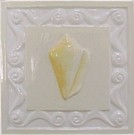 handmade ceramic tile with a high relief shell design and a multi-colored glaze