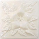 handmade ceramic tile with a high relief flower design and one glaze color