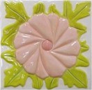 handmade ceramic tile with high relief flower design and multiple glaze colors