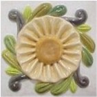 handmade ceramic tile with a high relief flower design and a multi-colored glaze