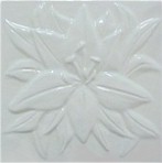 handmade ceramic tile with a high relief design and a one color glaze