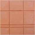 handmade terra cotta ceramic tile with a graphic design and a clear matte or gloss glaze