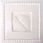 handmade ceramic tile with a high relief shell design and one color glaze