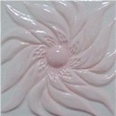 handmade ceramic tile with a high relief flower design and a multi-colored glaze