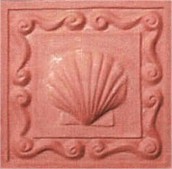 handmade terra cotta ceramic tile with a shell design and a clear matte or gloss glaze