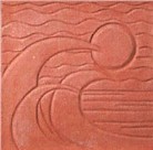 handmade terra cotta ceramic tile with a graphic design and a clear gloss or matte glaze
