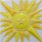 handmade ceramic tile with a high relief sun design and a multi-colored glaze