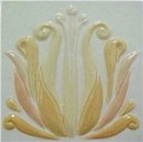 handmade ceramic tile with a high relief flower design and multiple glaze colors