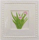 handmade ceramic tile with a high relief chive design and a multi-colored glaze