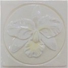 handmade ceramic tile with a high relief flower design and a multi-colored glaze