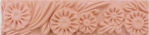 handmade terra cotta trim piece ceramic tile with a high relief design and a clear gloss or matte glaze