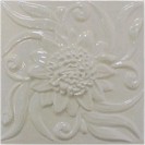 handmade ceramic tile with a high relief flower design and one glaze colors