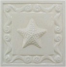 handmade ceramic tile with a high relief shell design and a one color glaze