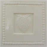 handmade ceramic tile with a high relief shell design and one color glaze